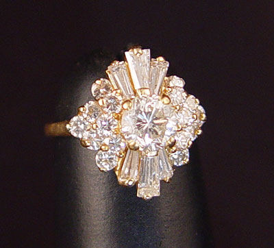 Appraisal: K DIAMOND ''BALLERINA'' RING K yellow gold ring centering an