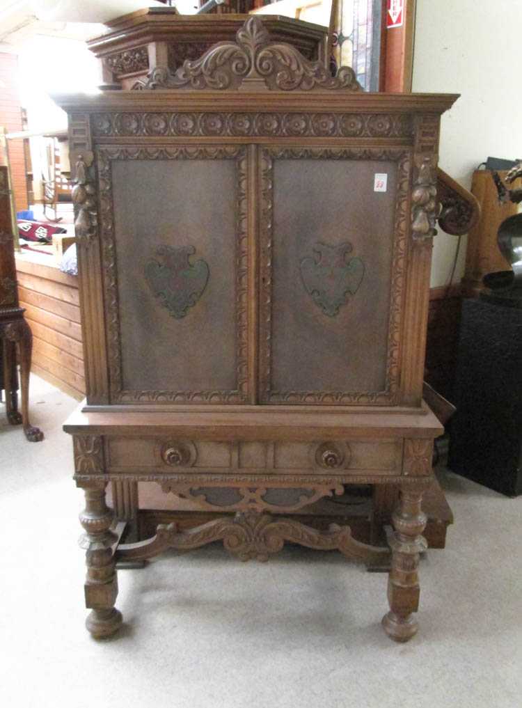 Appraisal: CARVED WALNUT CHINA CABINET ON STAND English style American c