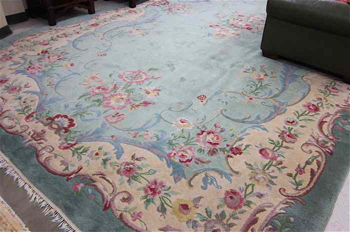 Appraisal: HAND KNOTTED ORIENTAL CARPET Indo-Aubusson central floral medallion and wide