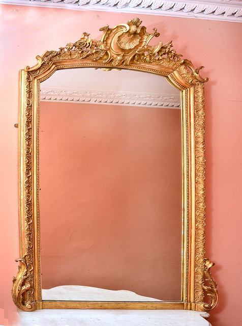 Appraisal: A LARGE TH CENTURY GILT PLASTER CONSOLE MIRROR with shell