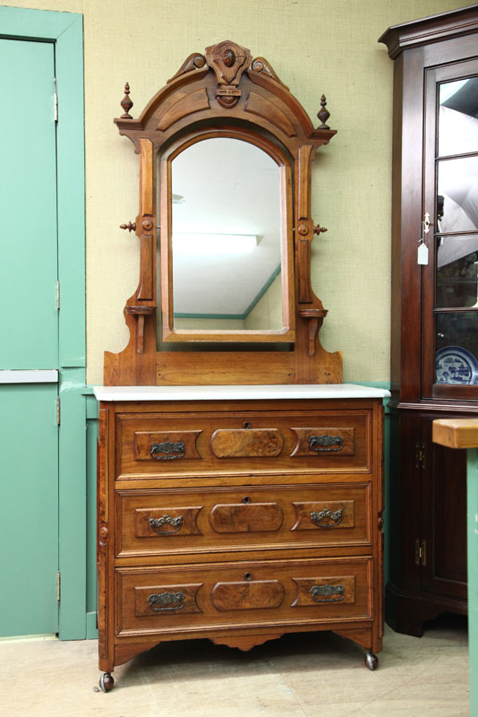 Appraisal: VICTORIAN CHEST OF DRAWERS WITH MIRROR Walnut having an arched