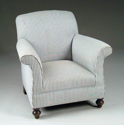 Appraisal: CHILD S UPHOLSTERED ARMCHAIR Over upholstered with striped upholstery turned