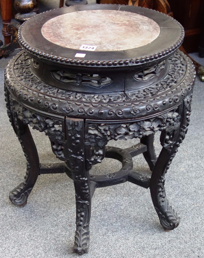 Appraisal: A late th century Chinese circular jardiniere stand the marble