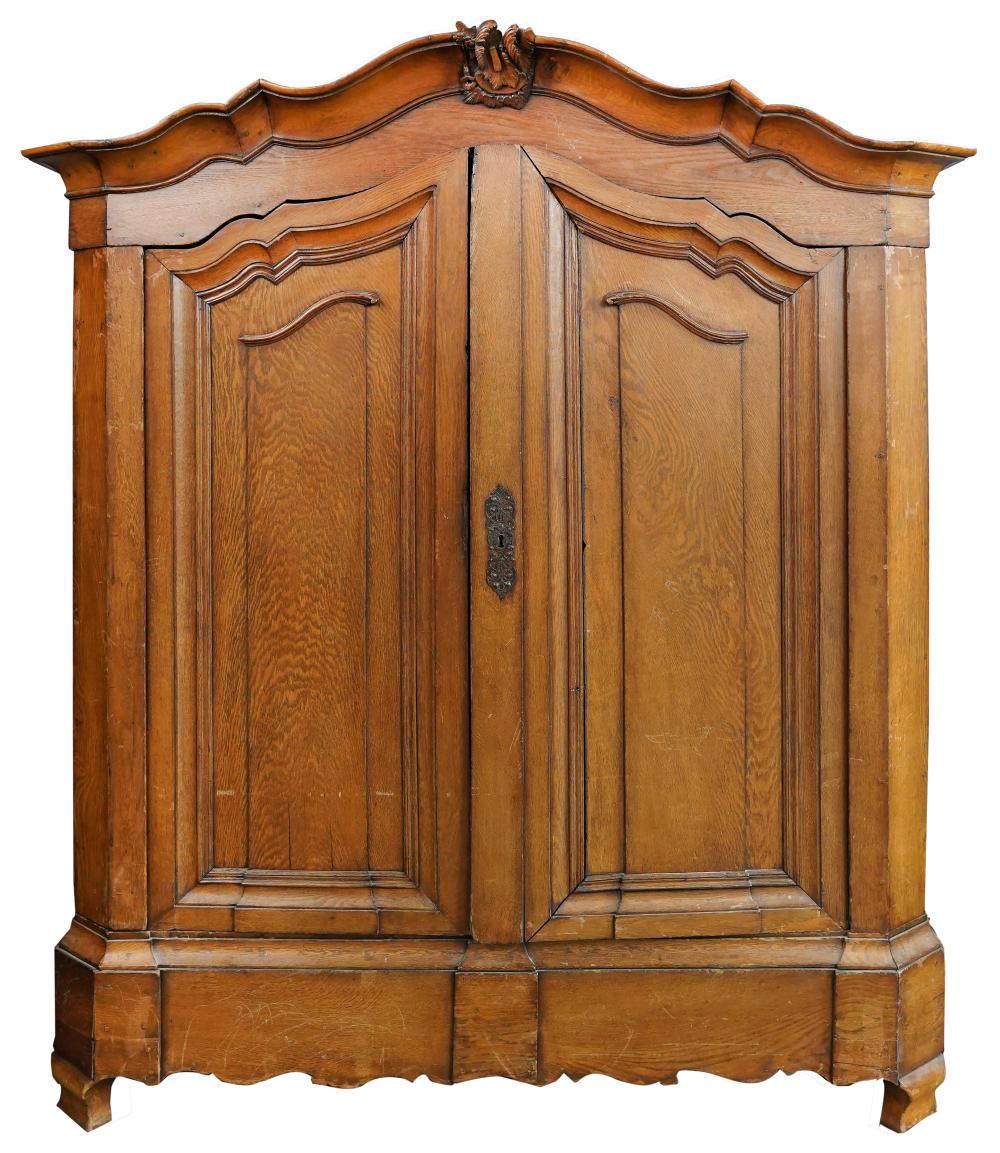 Appraisal: CONTINENTAL CARVED OAK ARMOIREwith five shelves enclosed by two doors