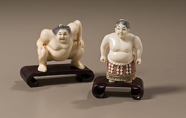 Appraisal: CARVED IVORY NETSUKES OF SUMO WRESTLERS late th century A