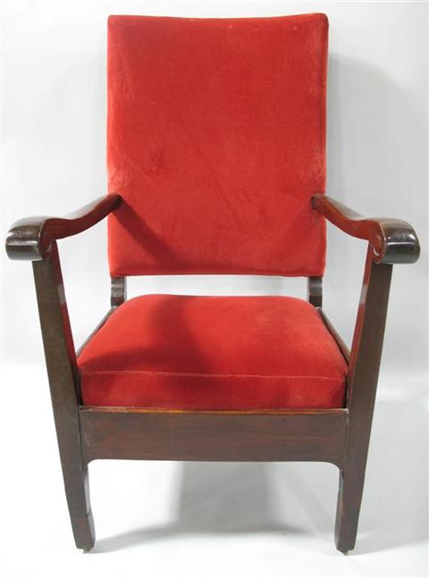 Appraisal: RED VELVET UPHOLSTERED ARMCHAIR Circa 's the rectangular padded back