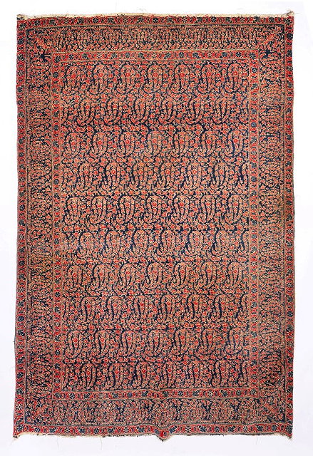 Appraisal: AN OLD TABRIZ DARK BLUE GROUND RUG decorated with a