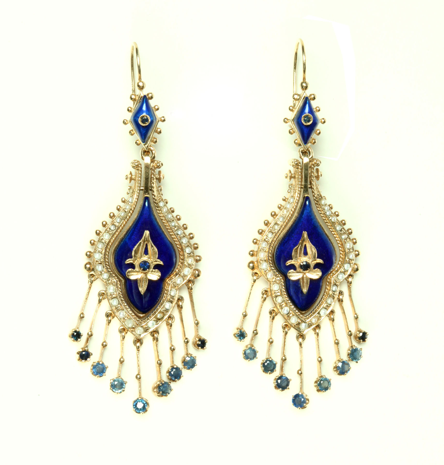 Appraisal: VICTORIAN REVIVAL-STYLE SAPPHIRE AND ENAMEL EARRINGS Twentieth century Modified navette