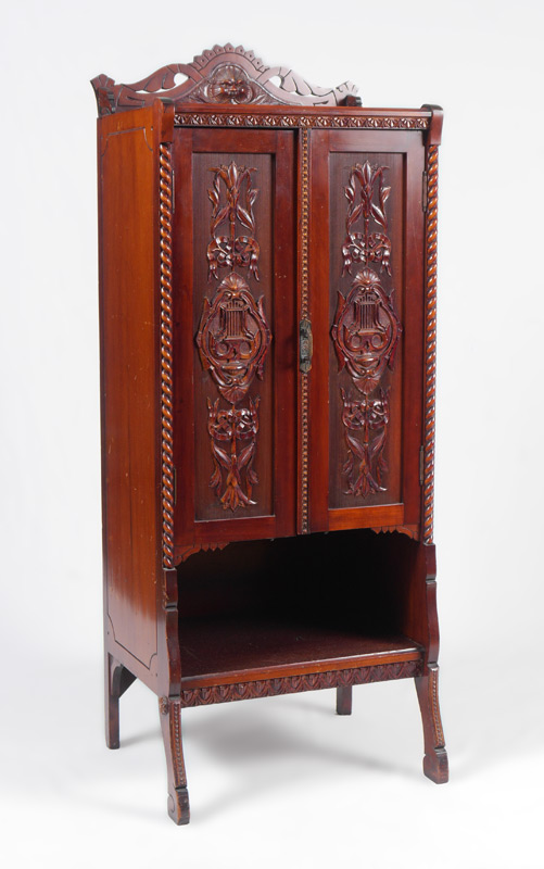 Appraisal: VICTORIAN CARVED MAHOGANY MUSIC CABINET Carved and pierced crest with