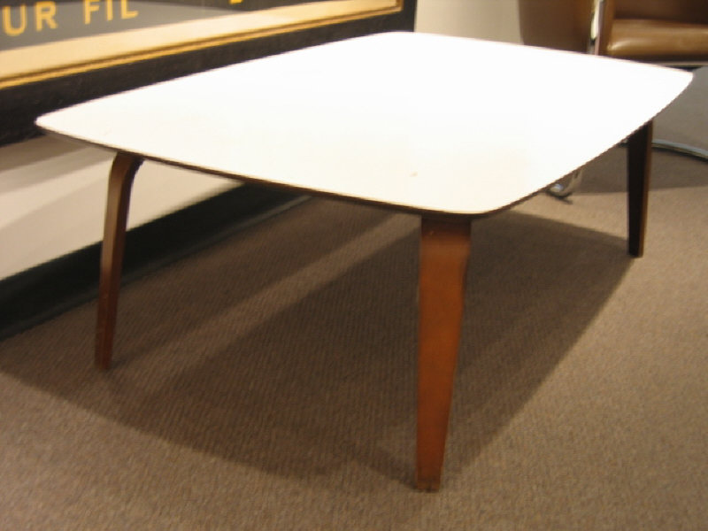 Appraisal: WHITE LAMINATE COFFEE TABLE the rectangular top with rounded corners