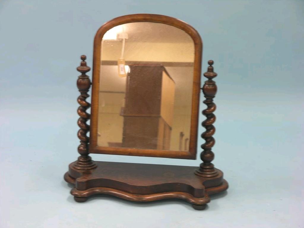 Appraisal: A Victorian mahogany dressing mirror domed plate adjustable on barley-twist