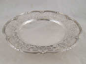 Appraisal: A pierced silver dish with lobed reeded rim on three