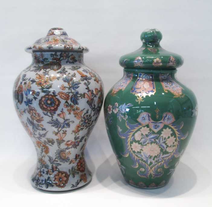 Appraisal: TWO EGLOMISE LIDDED URNS reverse painted in floral motifs one