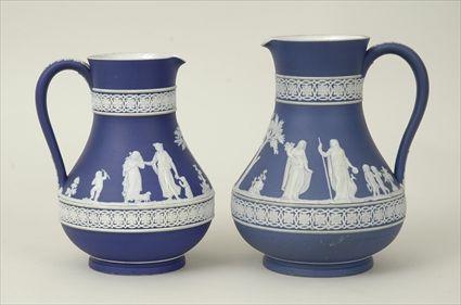 Appraisal: Two Wedgwood Dark Blue Jasperware Pitchers Marked to in