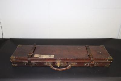 Appraisal: A fitted leather gun case with some cleaning accessories the