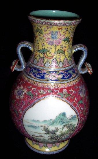 Appraisal: A th Century Chinese twin-handled vase decorated birds and landscapes