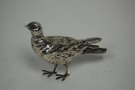 Appraisal: A model of a game bird indistinctly marked to foot