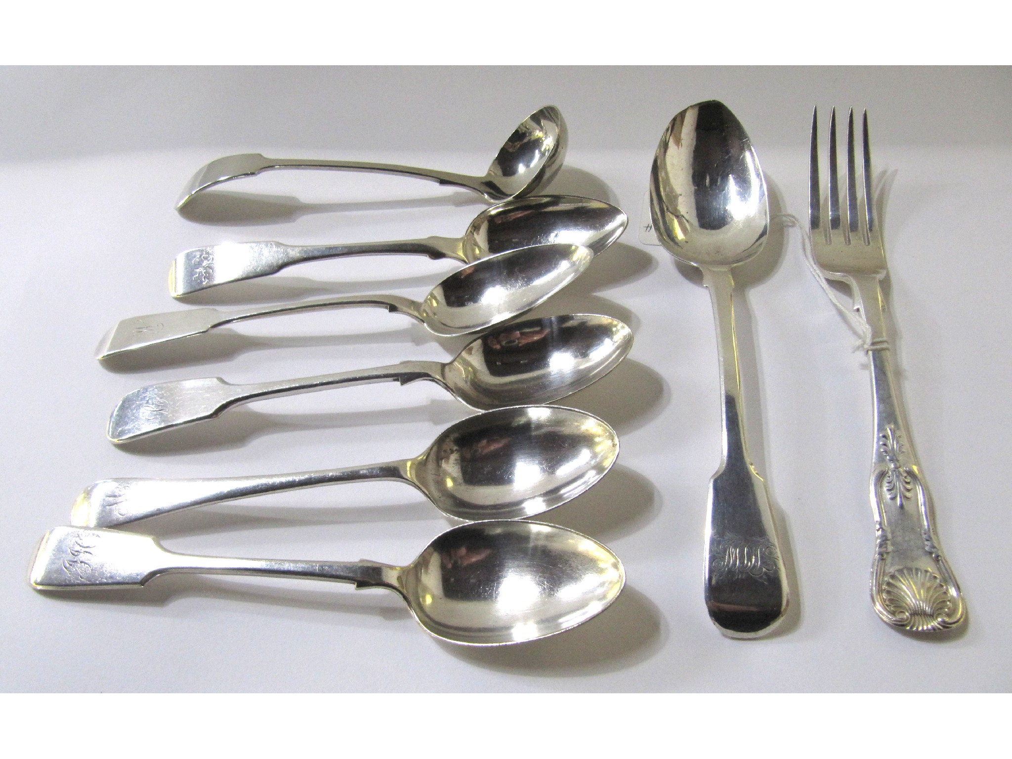 Appraisal: A lot comprising a silver fork Edinburgh three silver tablespoons