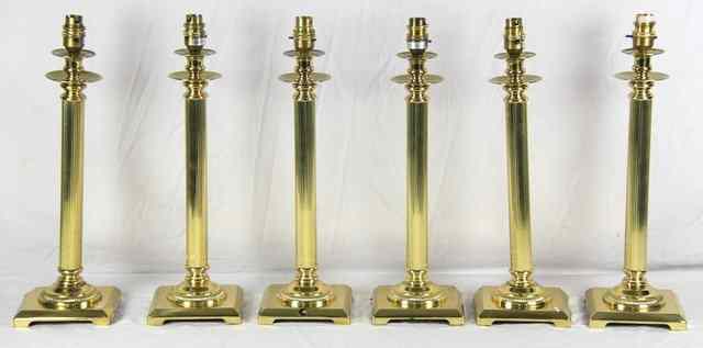 Appraisal: Six brass table lamps with reeded columns and stepped bases