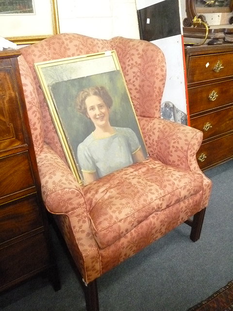 Appraisal: A GEORGIAN STYLE PINK UPHOLSTERED WING BACK ARMCHAIR standing on