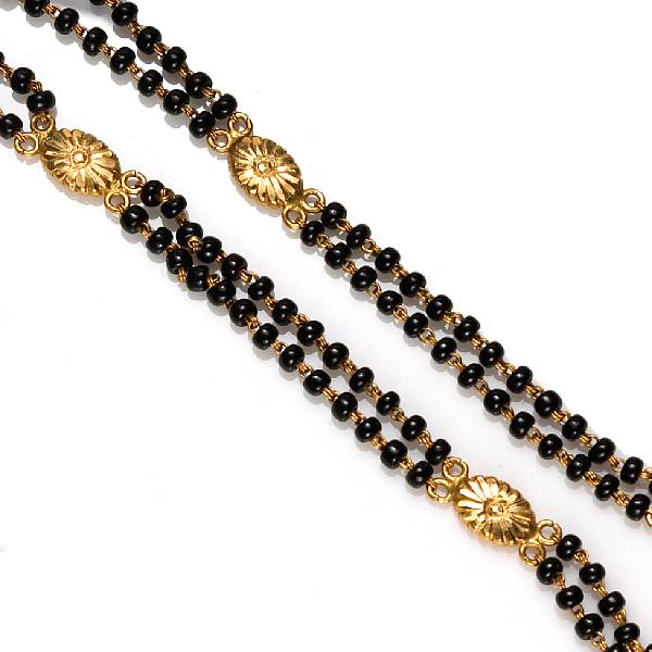 Appraisal: A black glass bead and k karat gold necklace