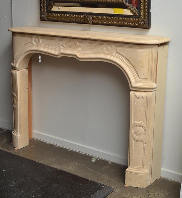 Appraisal: A COMPOSITE FIRE SURROUND with a rounded rectangular mantel piece