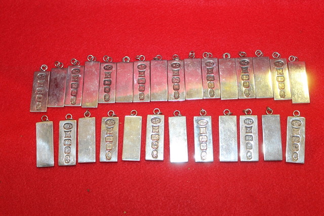 Appraisal: A COLLECTION OF MODERN SILVER INGOT PENDANTS grams