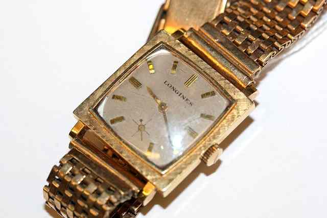 Appraisal: A LADIES LONGINES GOLD WRIST WATCH square silvered dial with