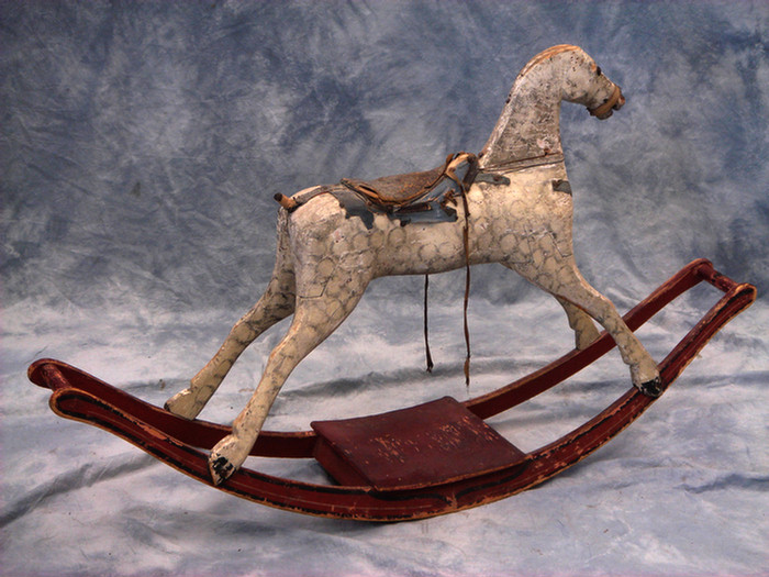 Appraisal: Carved and grey dapple painted folk art rocking horse red