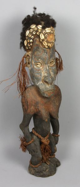 Appraisal: New Guinea female ancestral wood figure having applied shells and