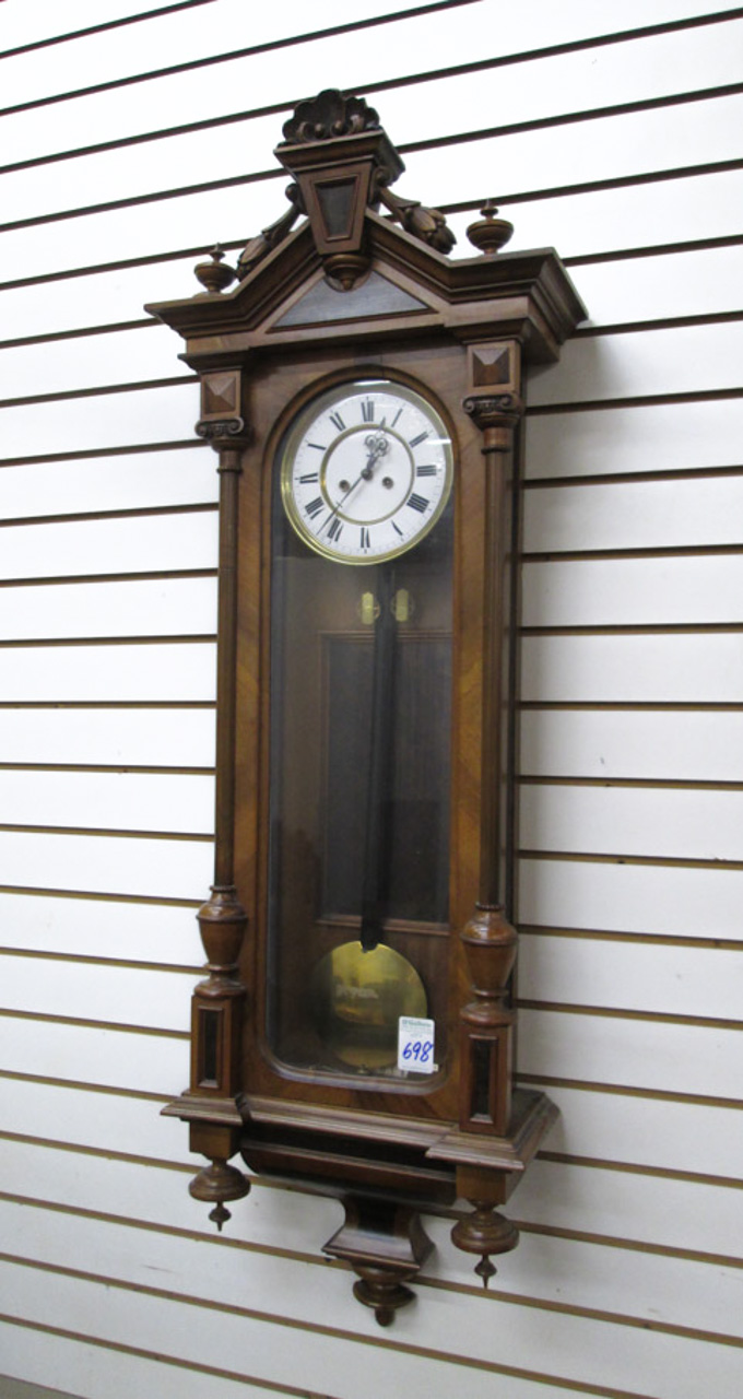 Appraisal: A TWO-WEIGHT LONGCASE WALL CLOCK Austria or Germany late th