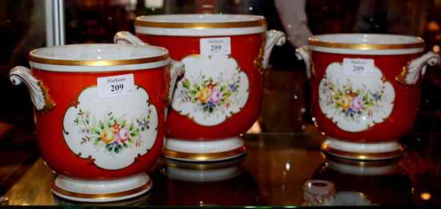 Appraisal: A PAIR OF PORTUGUESE PORCELAIN JARDINIERES and a similar but