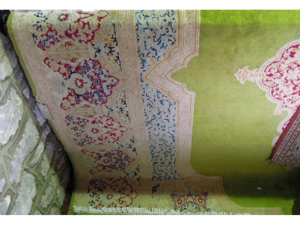 Appraisal: A Kerman style carpet with an unusual pea green field