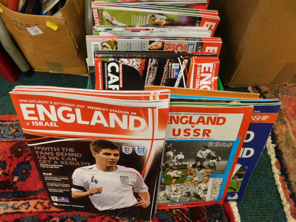 Appraisal: A quantity of England international football programmes one box