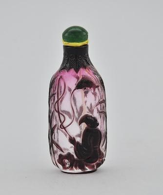 Appraisal: A Carved Cameo Glass Snuff Bottle Purple to clear glass