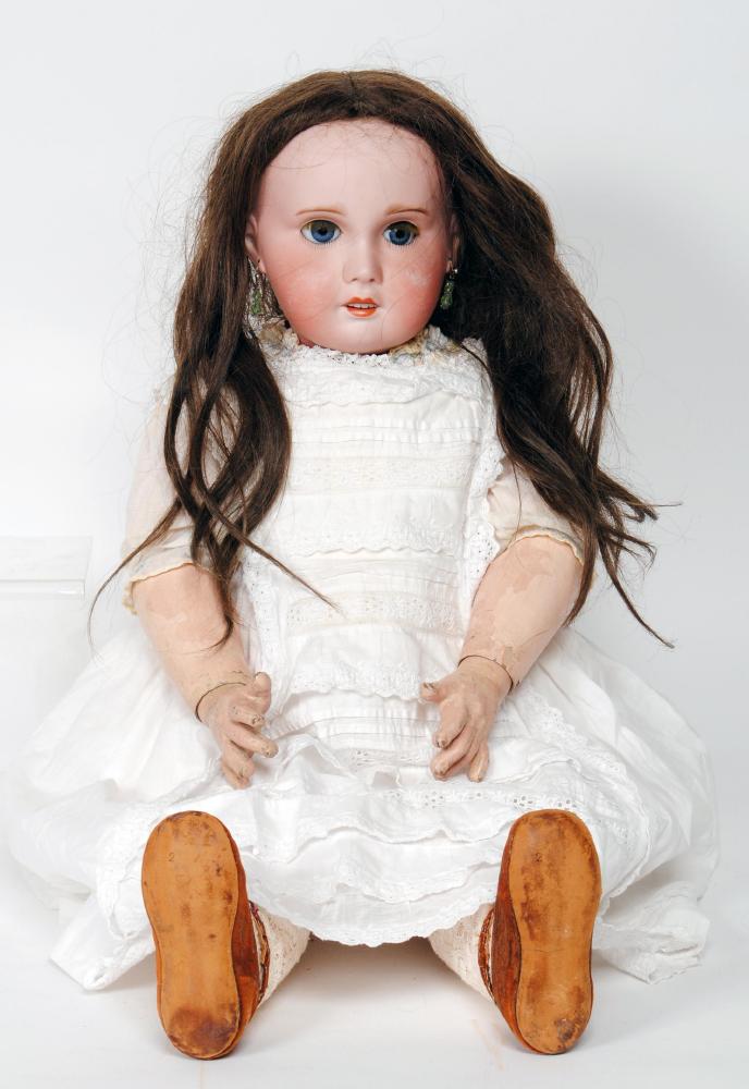 Appraisal: A large SFBJ bisque head girl doll with blue glass