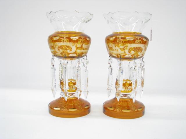 Appraisal: A pair of antique Bohemian amber glass lustres high one