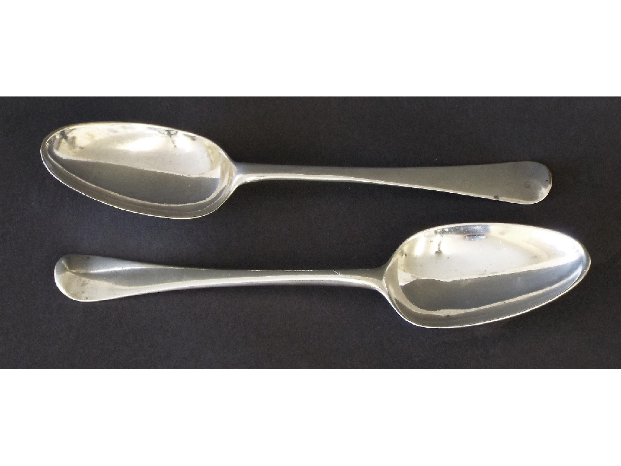 Appraisal: Pair of antique Old English silver table spoons with the