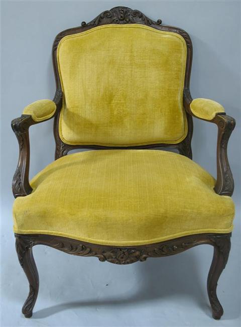 Appraisal: LOUIS XV STYLE GOLD UPHOLSTERED FAUTEUIL The carved crest over