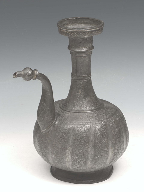 Appraisal: AN INDIAN PROBABLY DECCAN BRONZE METAL EWER with engraved decoration