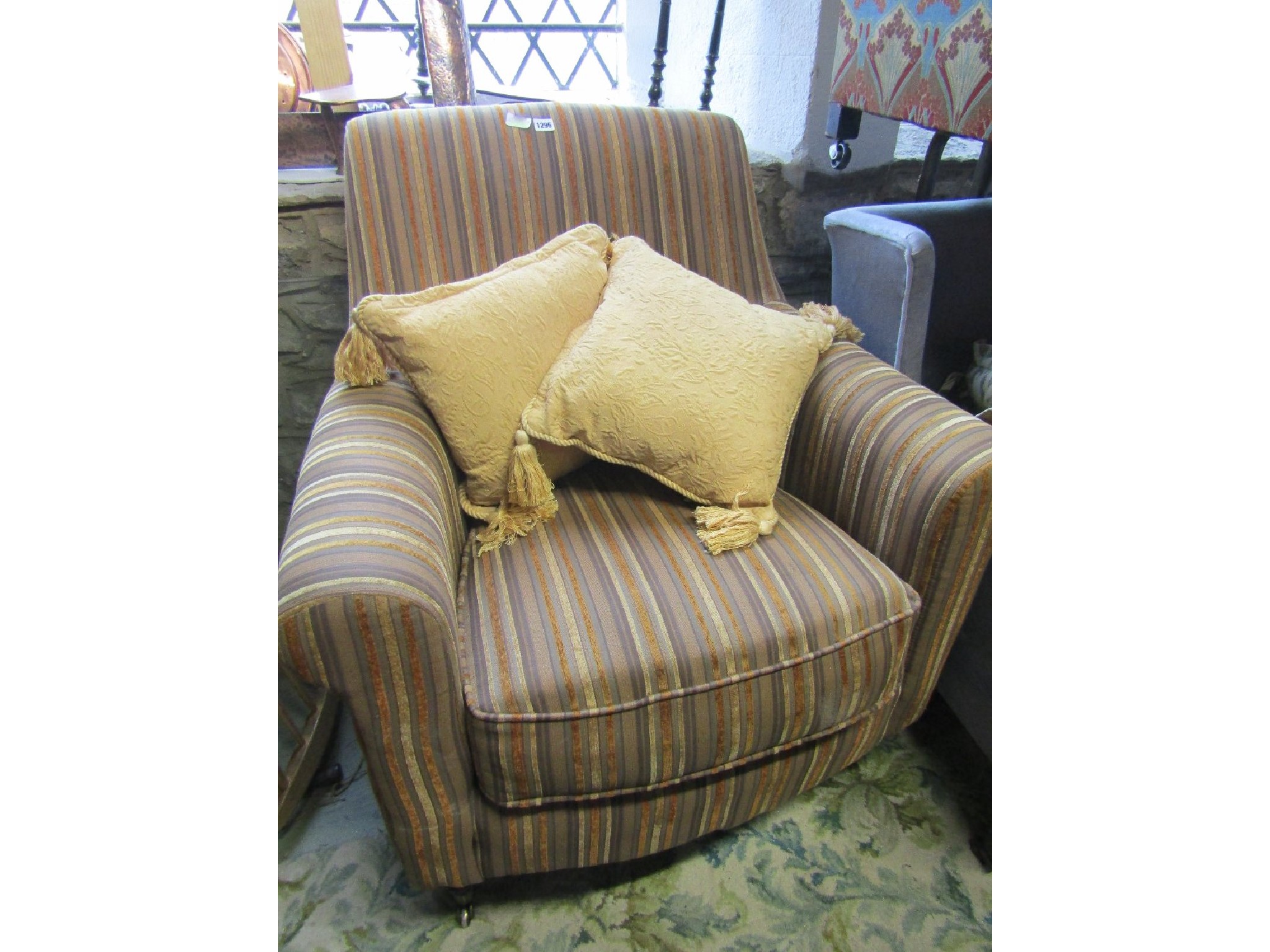 Appraisal: A good quality contemporary armchair with rolled arms shaped outline