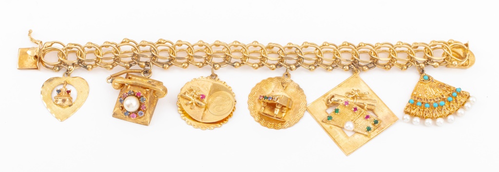 Appraisal: K YELLOW GOLD CHARM BRACELET K yellow gold bracelet brightly