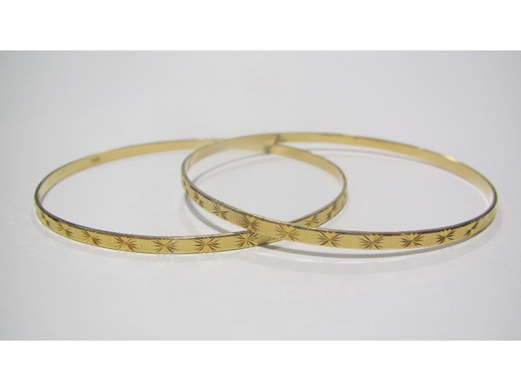 Appraisal: Two ct gold bangles Approximately gms