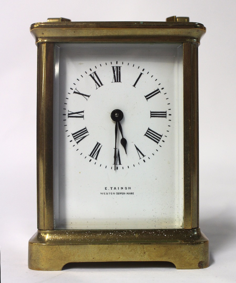 Appraisal: A brass cased carriage timepiece the white enamel dial signed