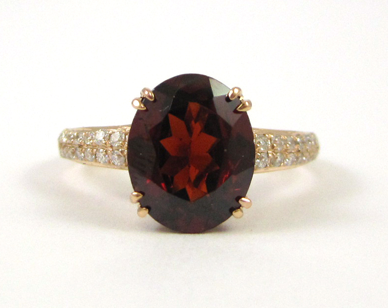 Appraisal: GARNET DIAMOND AND ROSE GOLD RING The k rose gold