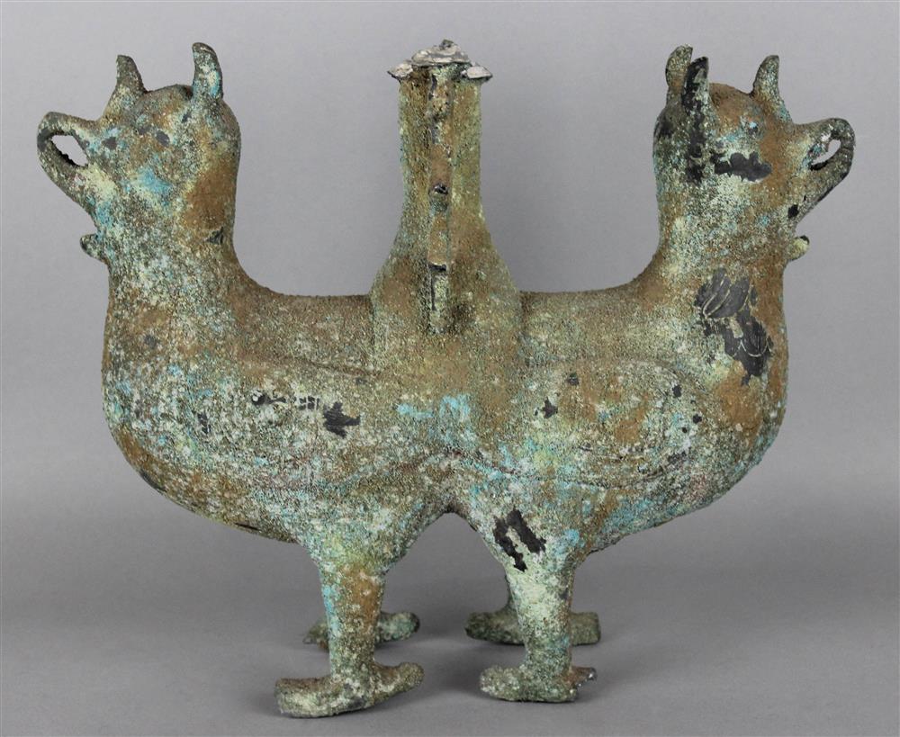 Appraisal: CHINESE DOUBLE MYTHICAL BIRD SUPPORT SHANG ZHOU DYNASTY the base