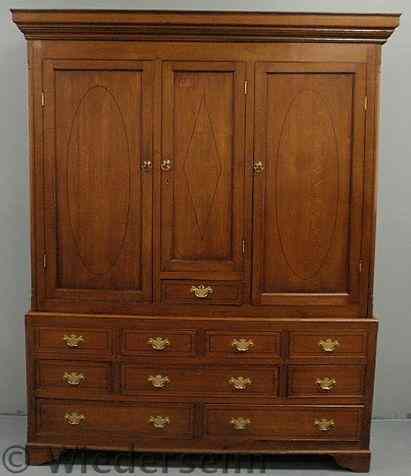 Appraisal: English oak two-piece linen press th c with ebony inlays