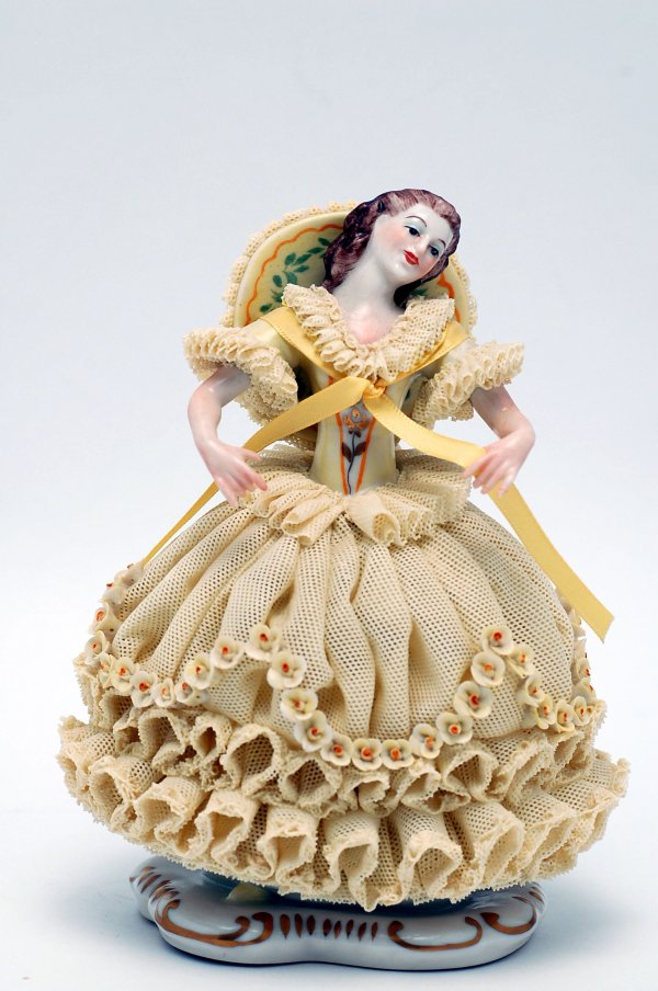 Appraisal: Irish Dresden figurine of a girl wearing a porcelain lace