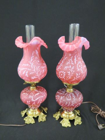 Appraisal: Pair of Cranberry Opalescent Banquet Lamps Fenton Spanish moss style