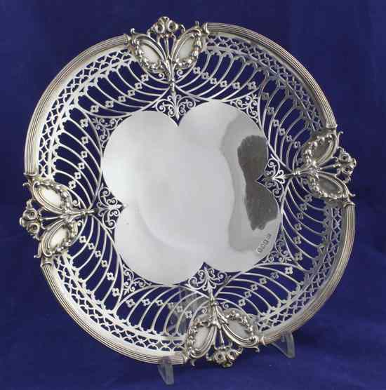 Appraisal: A George V pierced silver cake dish of quatrefoil shape